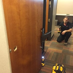 John Day installing commercial door hardware and locks
